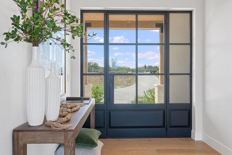 Entryway with baseboards and wood finished floors Entryway with baseboards and wood finished floors