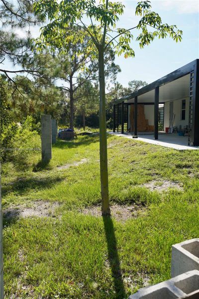 Front exterior of a new home in , Lehigh Acres, FL, highlighting curb appeal (Image 24).