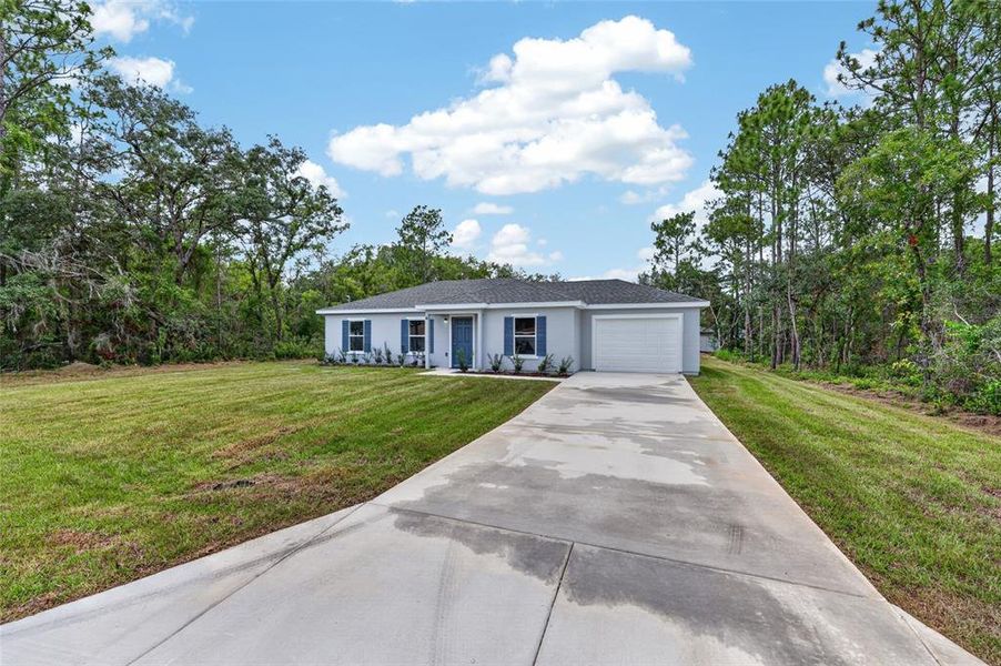 Front exterior of a new home in , Ocala, FL, highlighting curb appeal (Image 17).