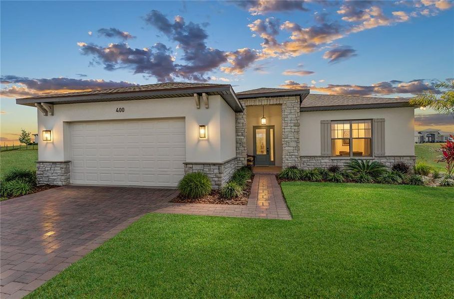 Front exterior of a new home in , Auburndale, FL, highlighting curb appeal (Image 23).