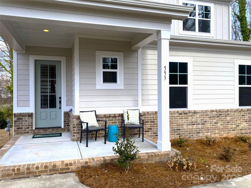 Front exterior of a new home in , Mooresville, NC, highlighting curb appeal (Image 1).