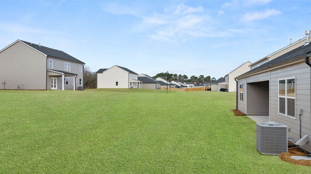 Exterior details and patio area of a home in Bridle Creek, Locust Grove (Image 3).
