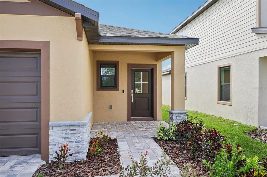 Exterior details and patio area of a home in Grasslands West, Lakeland (Image 4).