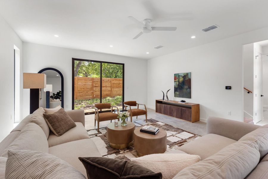 The living room enjoys peaceful views of the private, shaded backyard. The living room enjoys peaceful views of the private, shaded backyard.