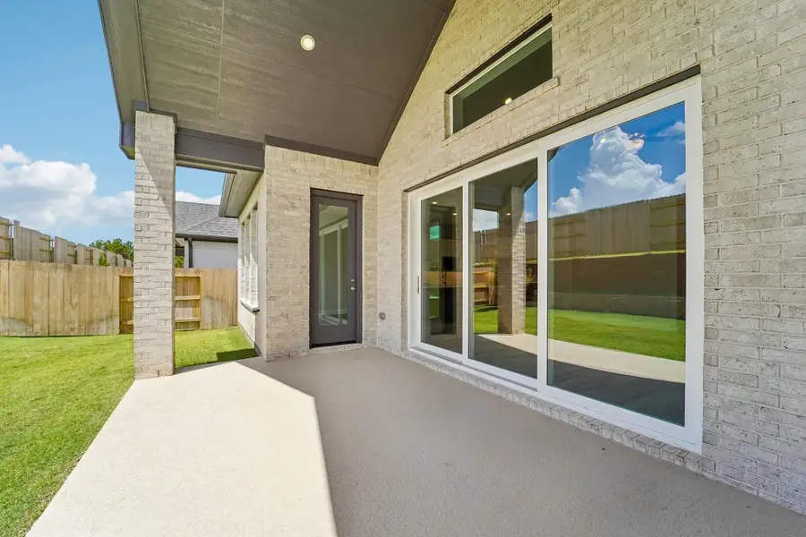 Exterior details and patio area of a home in WILDTREE 60', Montgomery (Image 4).