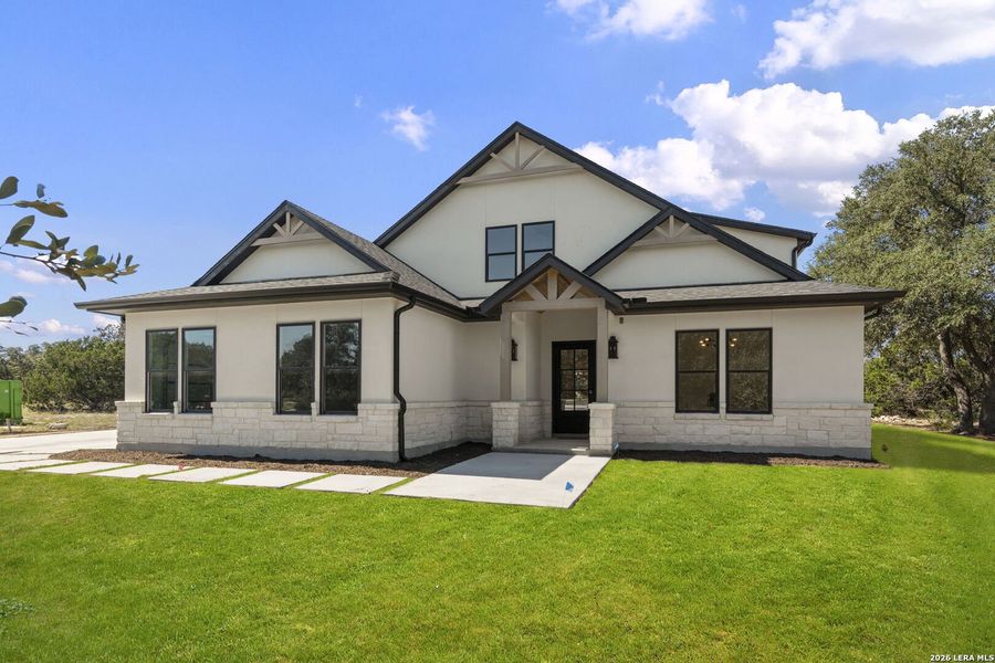 Front exterior of a new home in , Bandera, TX, highlighting curb appeal (Image 28).