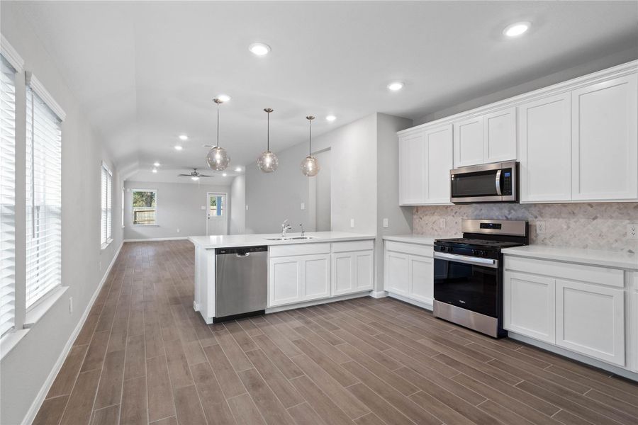 From the expansive kitchen, enjoy seamless sightlines across the open-concept living and dining areas, making entertaining a breeze and ensuring you're never far from the conversation.