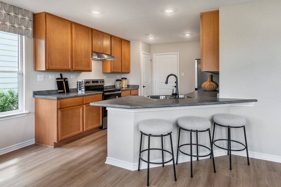 Representative furnished interior of a home built from the 1389 Modeled by KB Home in Preserve at Culebra - Villa Collection, San Antonio (Image 6). Representative furnished interior of a home built from the 1389 Modeled by KB Home in Preserve at Culebra - Villa Collection, San Antonio (Image 6).