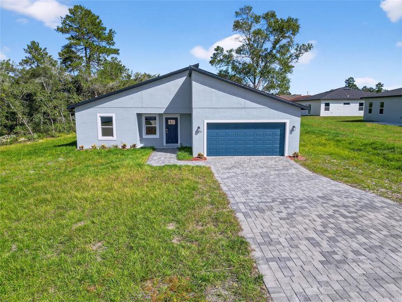 Front exterior of a new home in , Ocala, FL, highlighting curb appeal (Image 1). Front exterior of a new home in , Ocala, FL, highlighting curb appeal (Image 1).