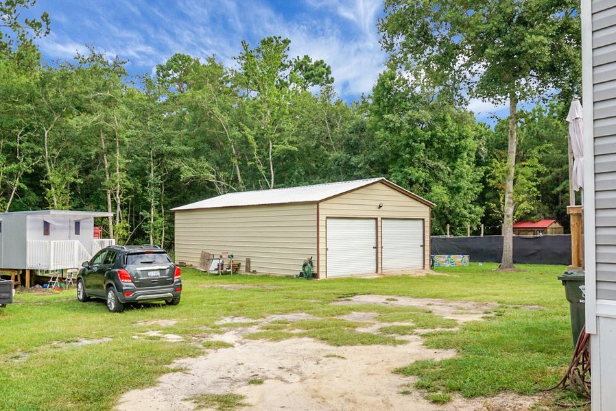 Front exterior of a new home in , Bonneau, SC, highlighting curb appeal (Image 32).