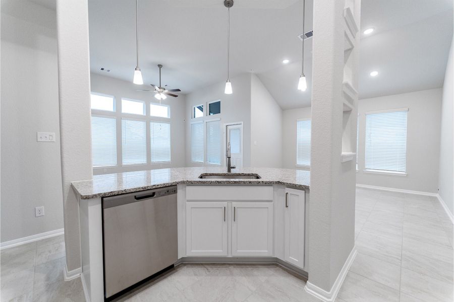 Furnished interior view inside a new home in Creekhaven, Iowa Colony (Image 6).