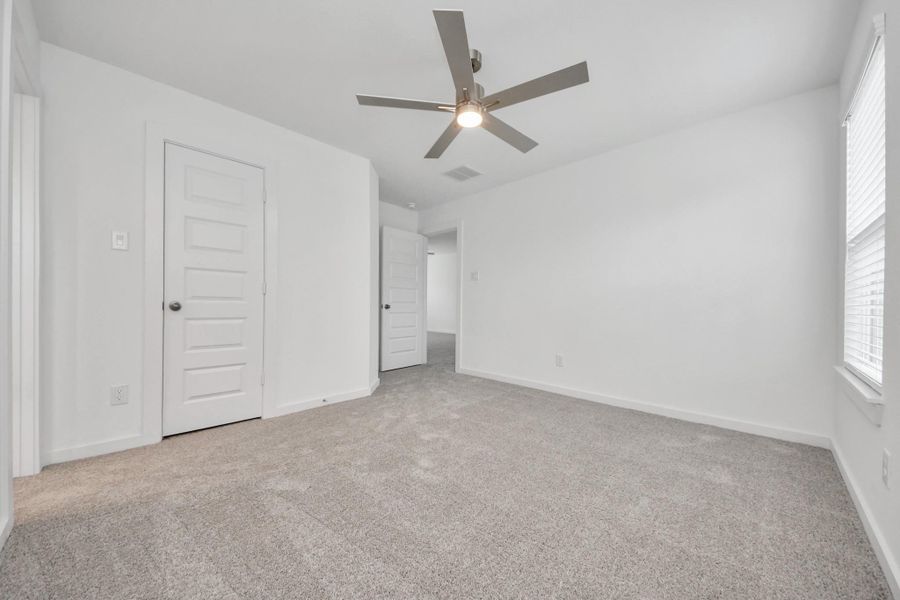 Generously sized secondary bedrooms featuring spacious closets, soft and inviting carpeting underfoot, large windows allowing plenty of natural light, and the added touch of privacy blinds for your personal retreat. Sample photo of completed home with similar floor plan. Actual colors and selections may vary. Generously sized secondary bedrooms featuring spacious closets, soft and inviting carpeting underfoot, large windows allowing plenty of natural light, and the added touch of privacy blinds for your personal retreat. Sample photo of completed home with similar floor plan. Actual colors and selections may vary.