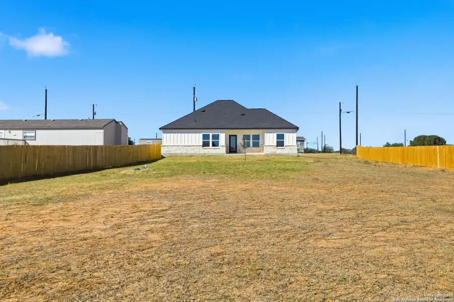 Exterior details and patio area of a home in , Atascosa (Image 3).