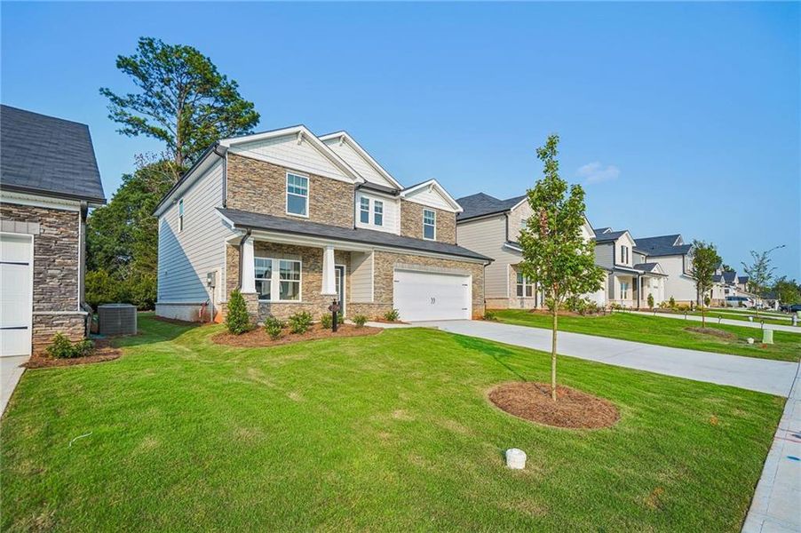 Front exterior of a new home in Martin Springs - Estate Series, Lawrenceville, GA, highlighting curb appeal (Image 24).