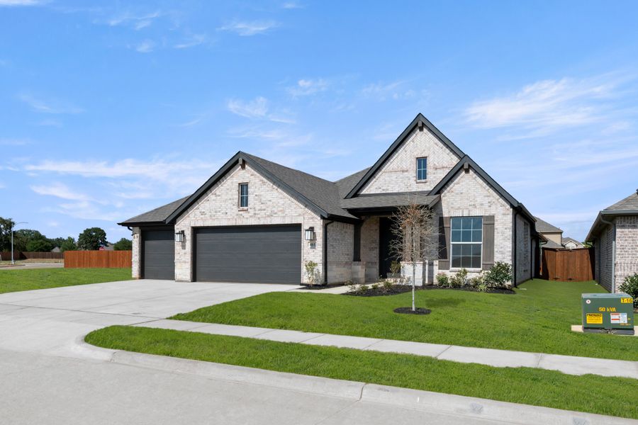 Front exterior of a new home in El Dorado, Granbury, TX, highlighting curb appeal (Image 2). Front exterior of a new home in El Dorado, Granbury, TX, highlighting curb appeal (Image 2).