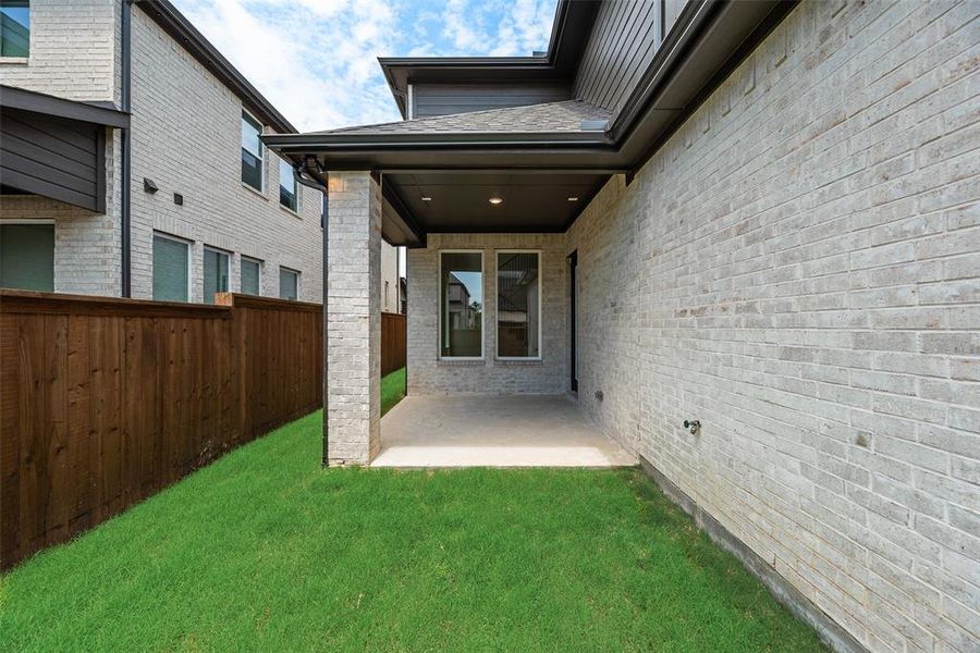 Exterior details and patio area of a home in The Grove Frisco - 40' Lots, Frisco (Image 4).