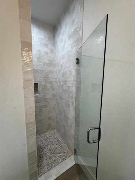 Bathroom with a shower with door