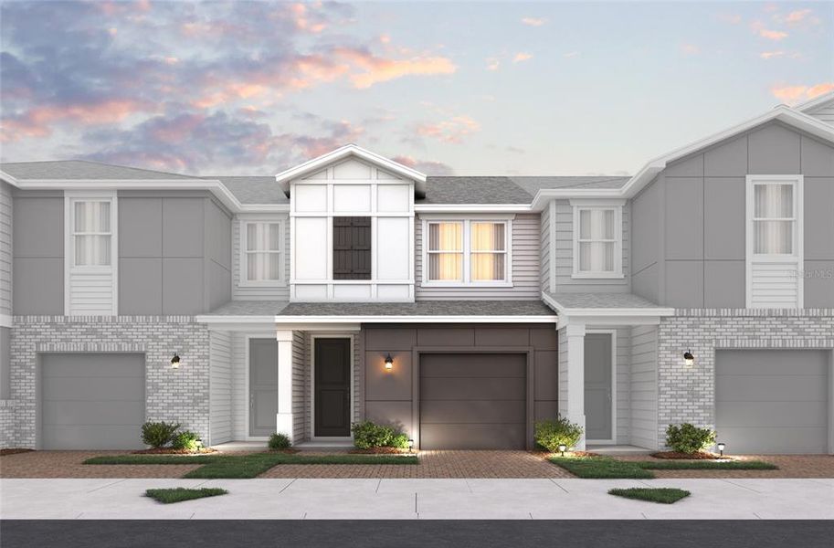 Front exterior of a new home in Towns at Riverwalk: Lake Monroe TH, Sanford, FL, highlighting curb appeal (Image 1).