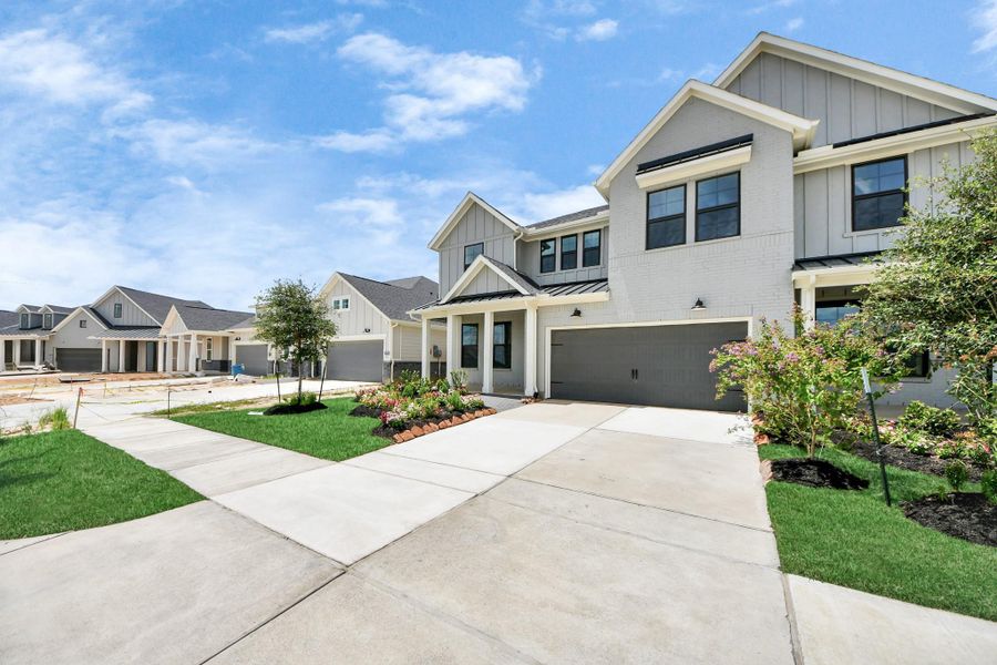 Front exterior of a new home in Bridgeland: Signature Collection, Cypress, TX, highlighting curb appeal (Image 18).
