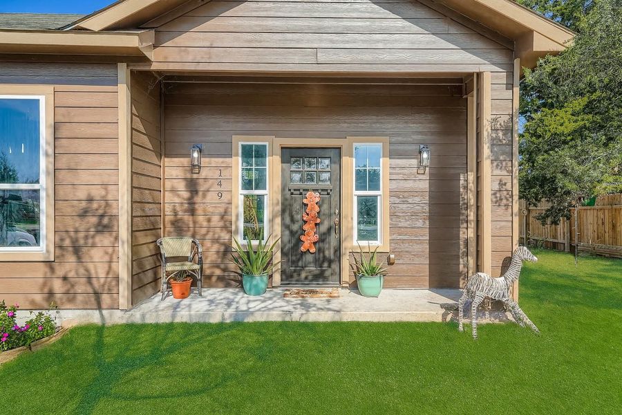 View of exterior entry featuring a porch View of exterior entry featuring a porch