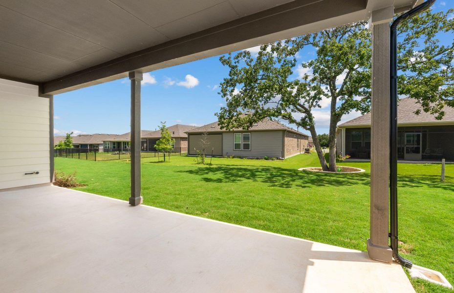 Front exterior of a new home in Sun City Texas, Georgetown, TX, highlighting curb appeal (Image 26). Front exterior of a new home in Sun City Texas, Georgetown, TX, highlighting curb appeal (Image 26).