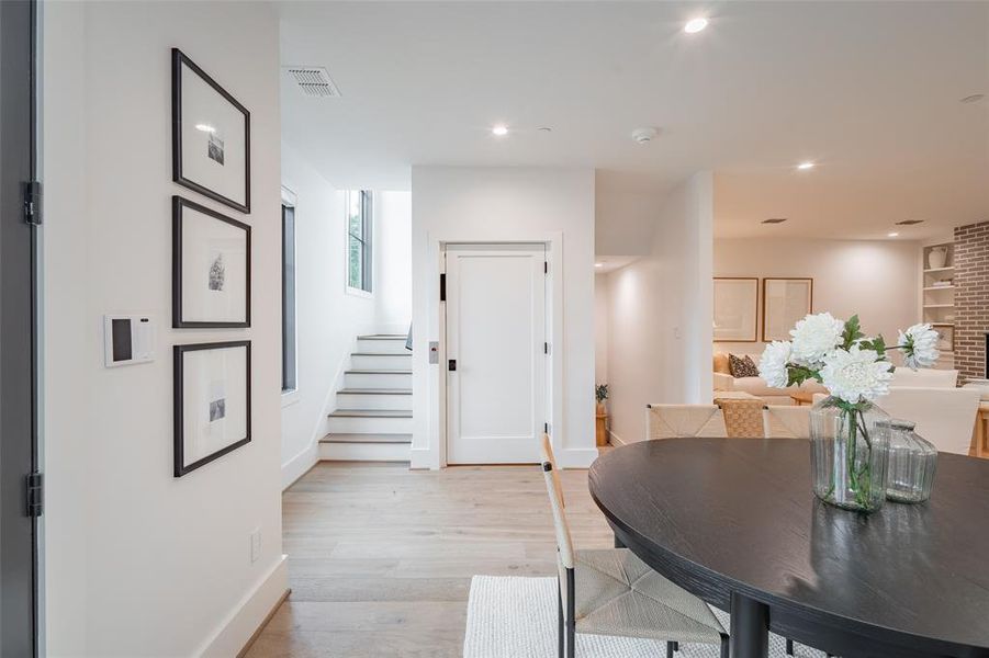 Dining area featuring built in features and light wood-type flooring