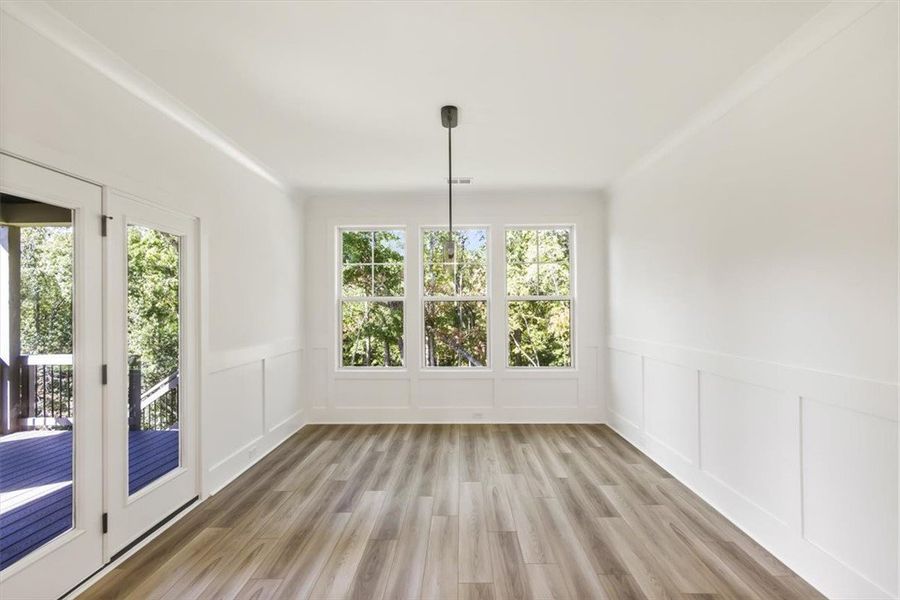 Elegant wood-patterned flooring and classic wainsc