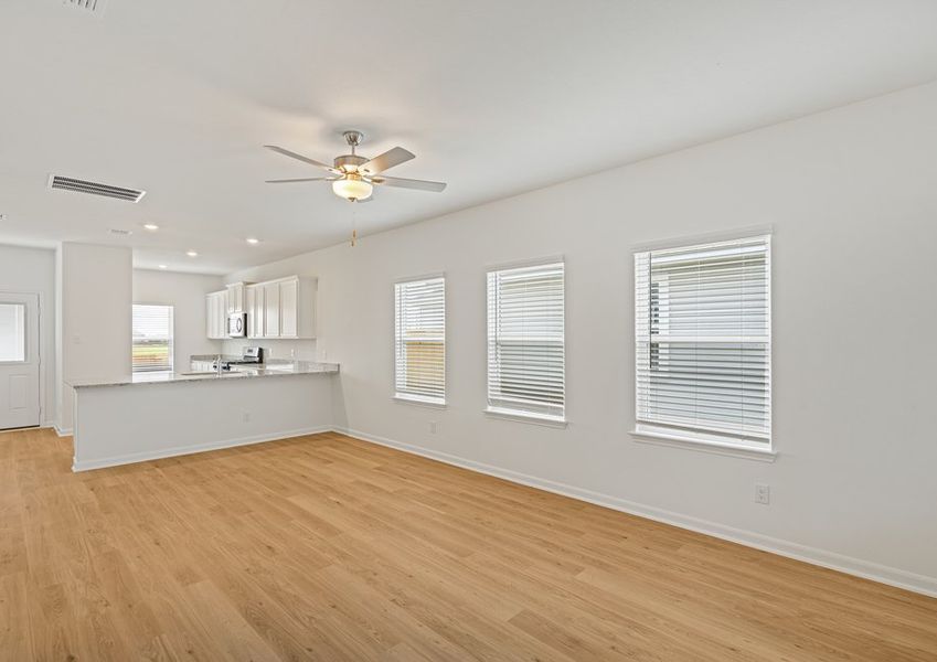 Spacious family room with vinyl flooring
