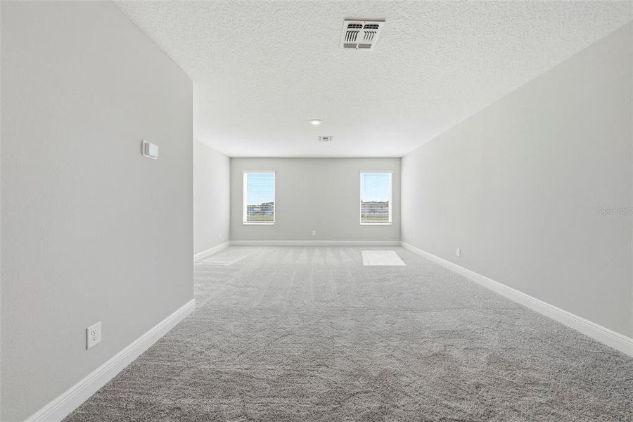 Spacious, unfurnished interior of a new home in Gum Lake Preserve, Lake Alfred (Image 22).