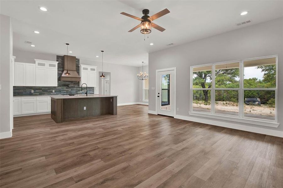 Open concept kitchen overlooks backyard