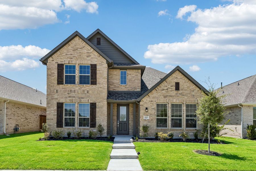 Front exterior of a new home in Dove Hollow, Waxahachie, TX, highlighting curb appeal (Image 22).