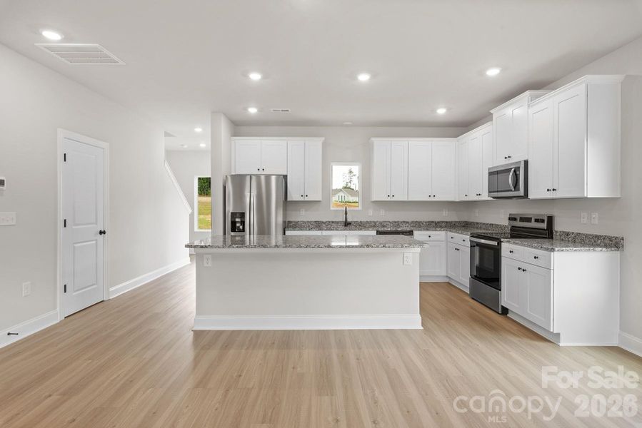 Furnished interior view inside a new home in Ascot Woods, Charlotte (Image 4).