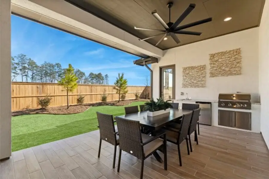 new construction homes magnolia covered patio and backyard
