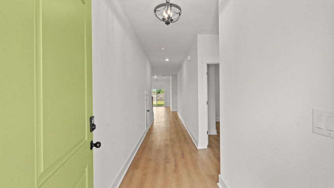 Inviting hallway with durable LVP flooring for a seamless, stylish entry.
