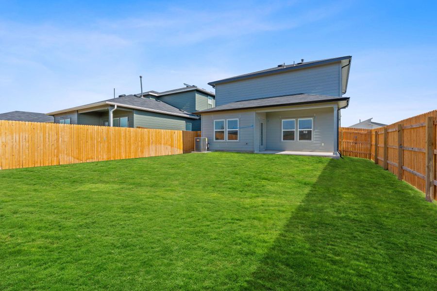 Rear view of property with a patio area and a fenced backyard Rear view of property with a patio area and a fenced backyard