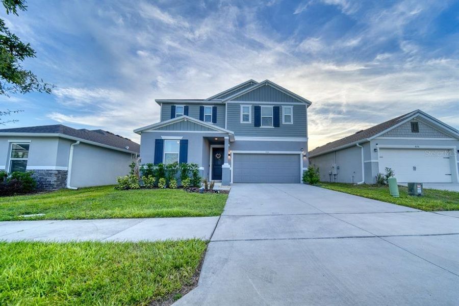 Front exterior of a new home in , Davenport, FL, highlighting curb appeal (Image 25). Front exterior of a new home in , Davenport, FL, highlighting curb appeal (Image 25).