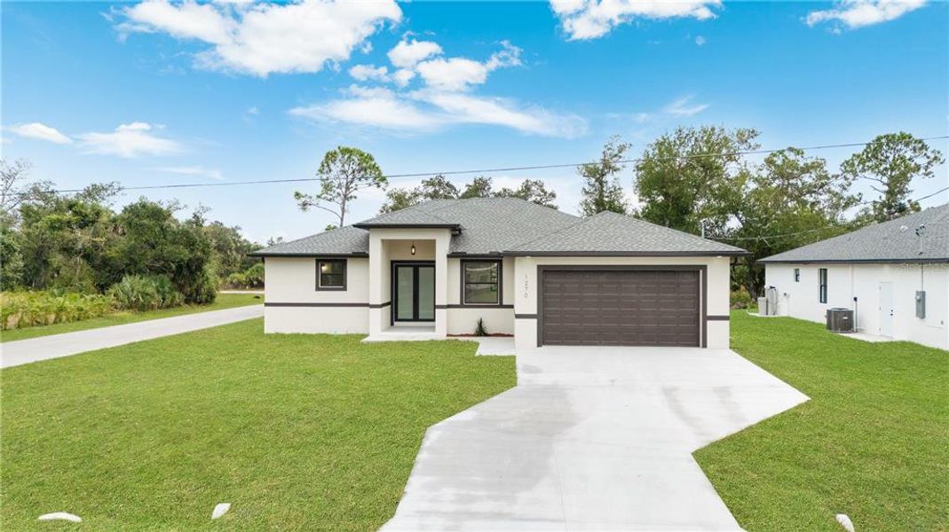 Front exterior of a new home in , Port Charlotte, FL, highlighting curb appeal (Image 26).