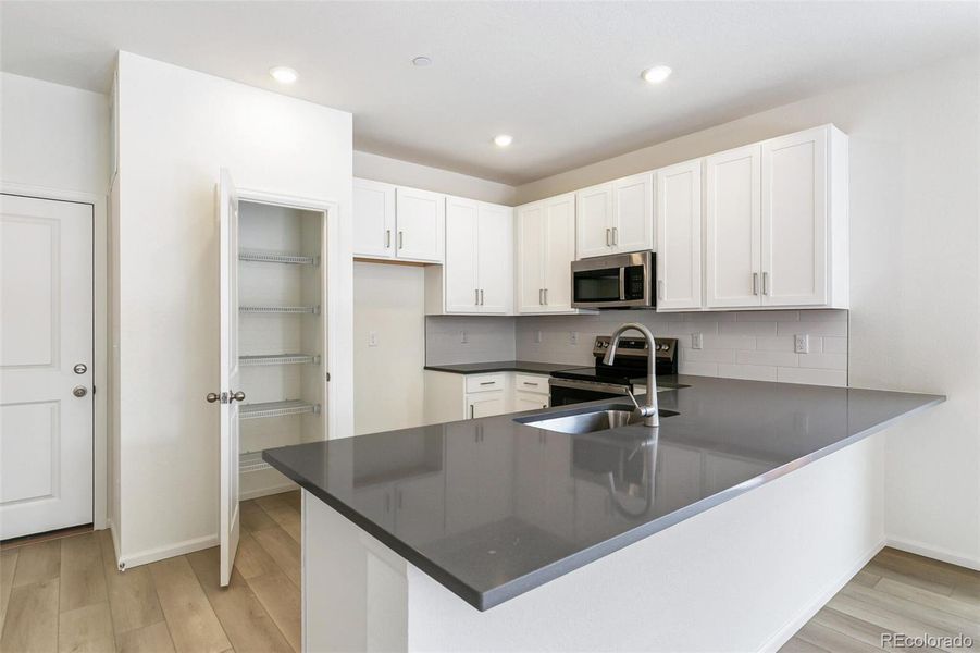 Furnished interior view inside a new home in Turnberry, Commerce City (Image 14).