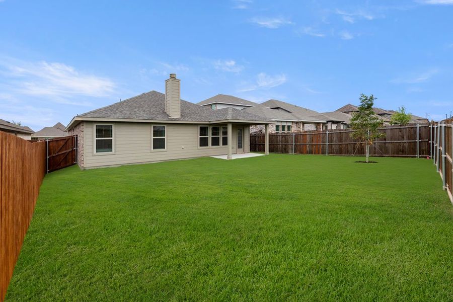Representative exterior photo of a completed home built from the Lincoln by Impression Homes in DeBerry Reserve, Royse City, TX (Image 26).