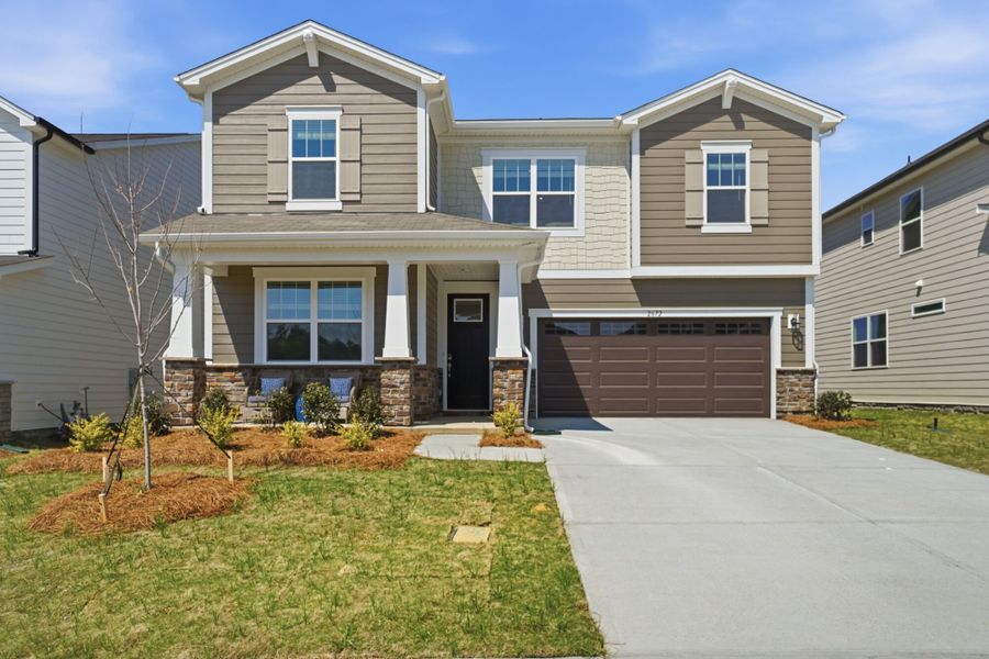 Front exterior of a new home in Waxhaw Landing, Monroe, NC, highlighting curb appeal (Image 1). Front exterior of a new home in Waxhaw Landing, Monroe, NC, highlighting curb appeal (Image 1).