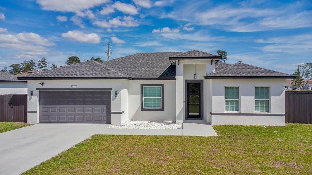 Front exterior of a new home in , Ocala, FL, highlighting curb appeal (Image 1). Front exterior of a new home in , Ocala, FL, highlighting curb appeal (Image 1).