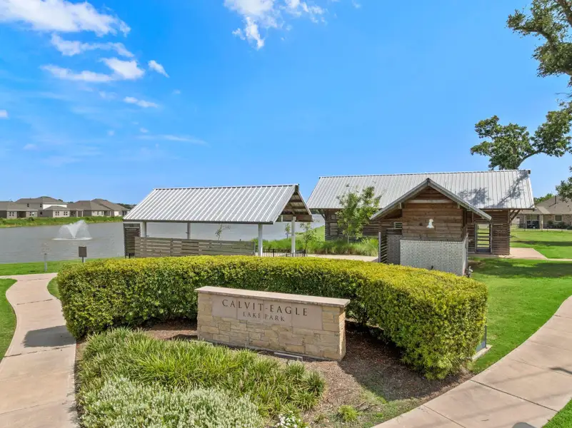 Front exterior of a new home in Woodshore, Clute, TX, highlighting curb appeal (Image 11).