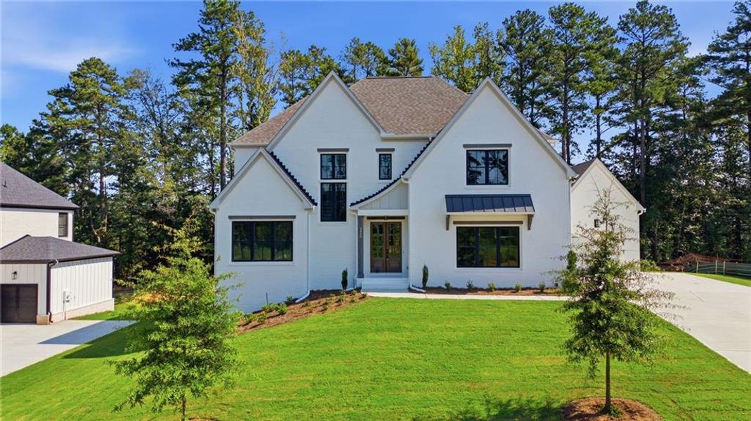 Front exterior of a new home in , Marietta, GA, highlighting curb appeal (Image 2). Front exterior of a new home in , Marietta, GA, highlighting curb appeal (Image 2).