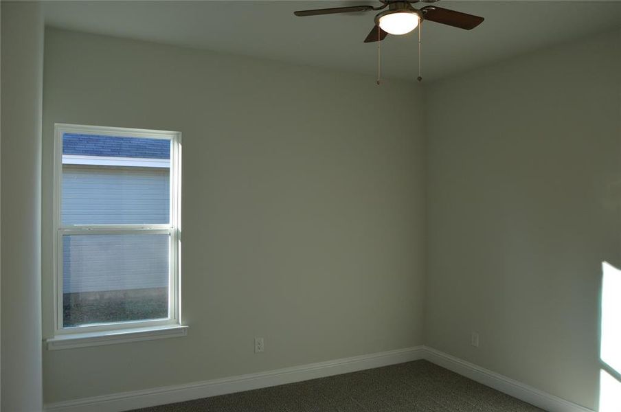 bedroom with carpet flooring and ceiling fan