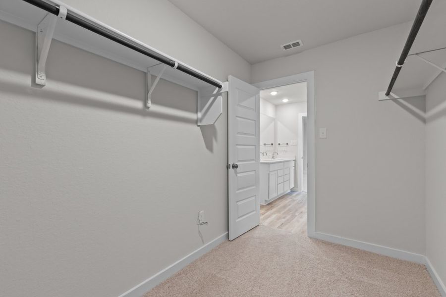 A hallway with white walls.