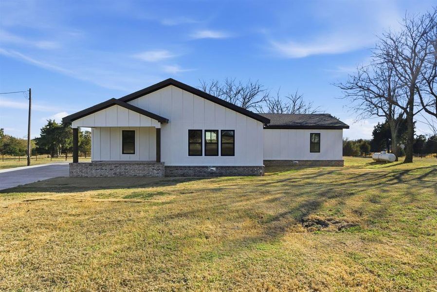 Front exterior of a new home in , Collinsville, TX, highlighting curb appeal (Image 1). Front exterior of a new home in , Collinsville, TX, highlighting curb appeal (Image 1).