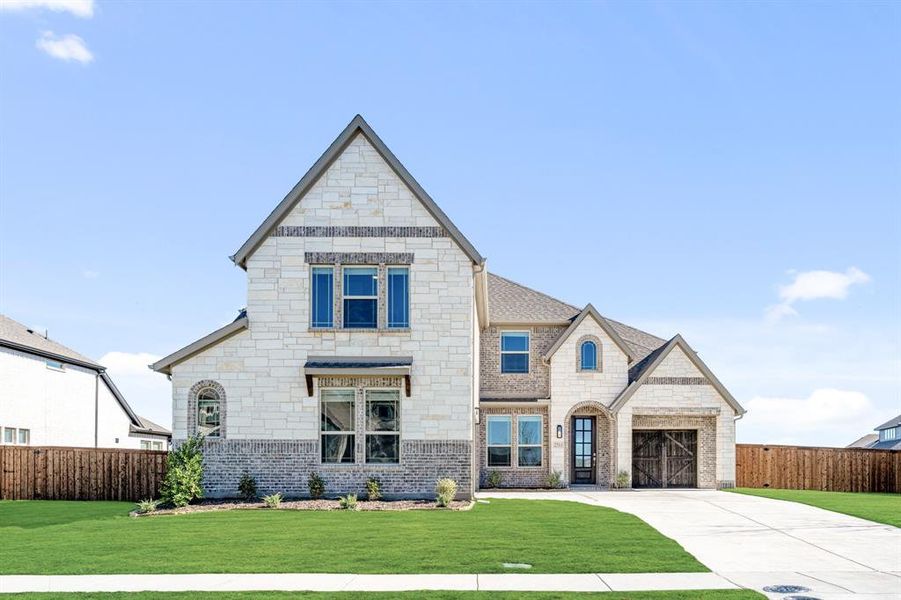 Front exterior of a new home in Terracina, Rockwall, TX, highlighting curb appeal (Image 1). Front exterior of a new home in Terracina, Rockwall, TX, highlighting curb appeal (Image 1).