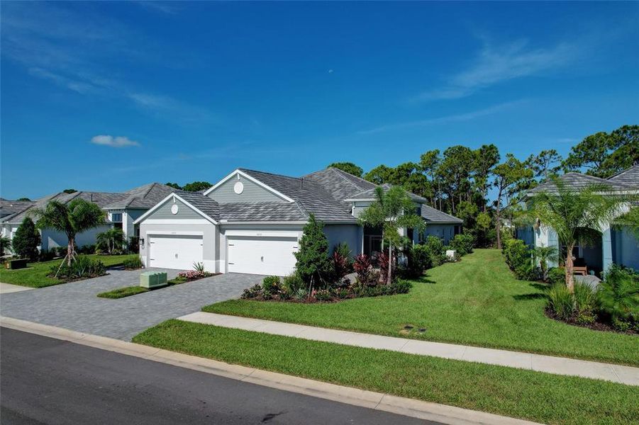 Front exterior of a new home in , Sarasota, FL, highlighting curb appeal (Image 27). Front exterior of a new home in , Sarasota, FL, highlighting curb appeal (Image 27).