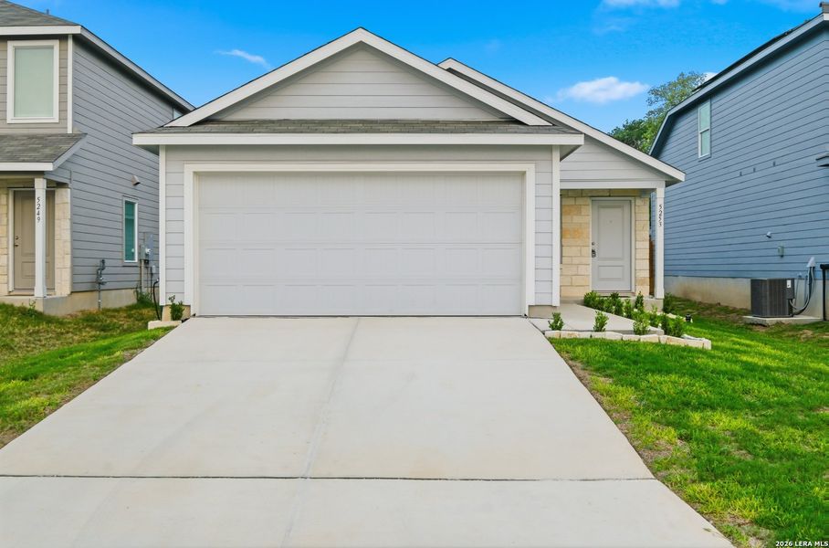 Front exterior of a new home in Morgan Heights, San Antonio, TX, highlighting curb appeal (Image 2).