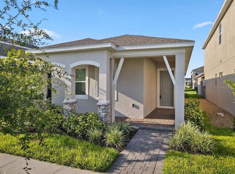 Front exterior of a new home in , Winter Garden, FL, highlighting curb appeal (Image 21).